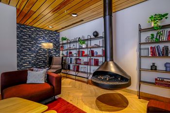 Expansive club room with fireplace, pool tables, full kitchen